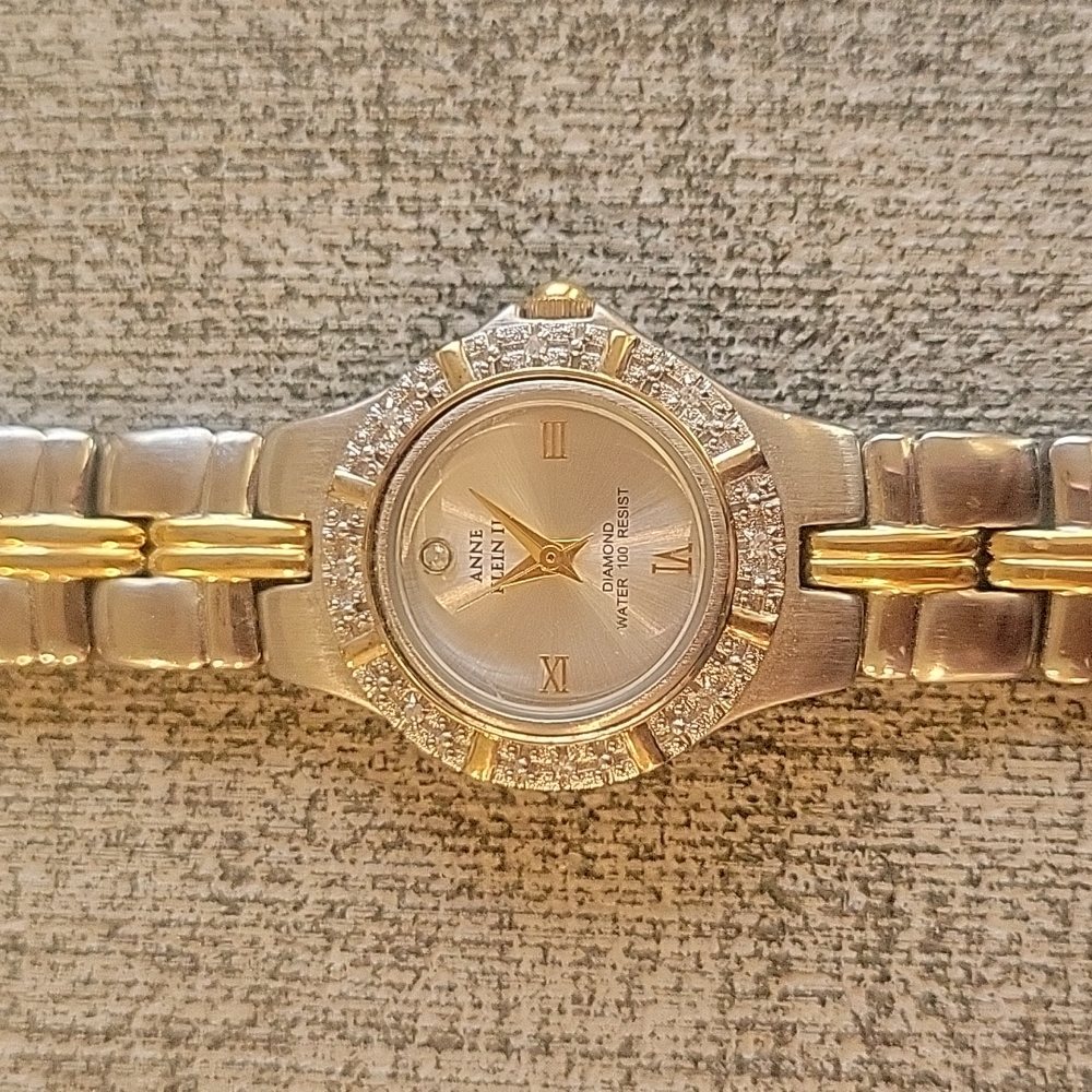 Silver and gold small face watch